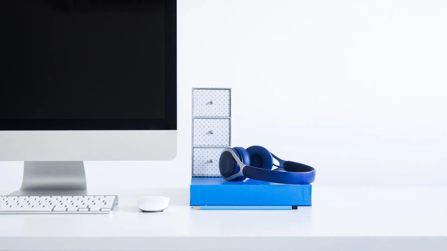 Modern office desk with monitor and peripherals
